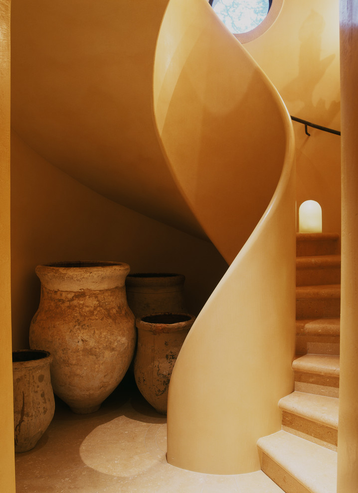 Inspiration for a mediterranean curved staircase remodel in San Francisco
