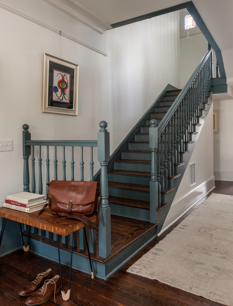 Example of a mid-sized ornate wooden l-shaped wood railing staircase design in Atlanta with wooden risers