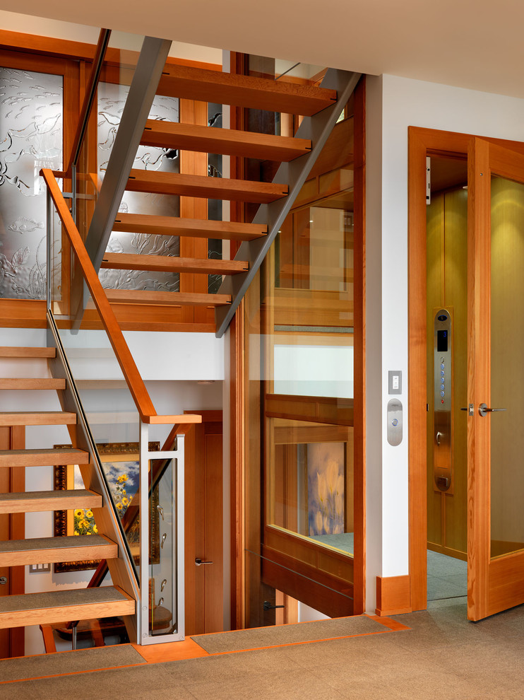 Example of a trendy open staircase design in Vancouver