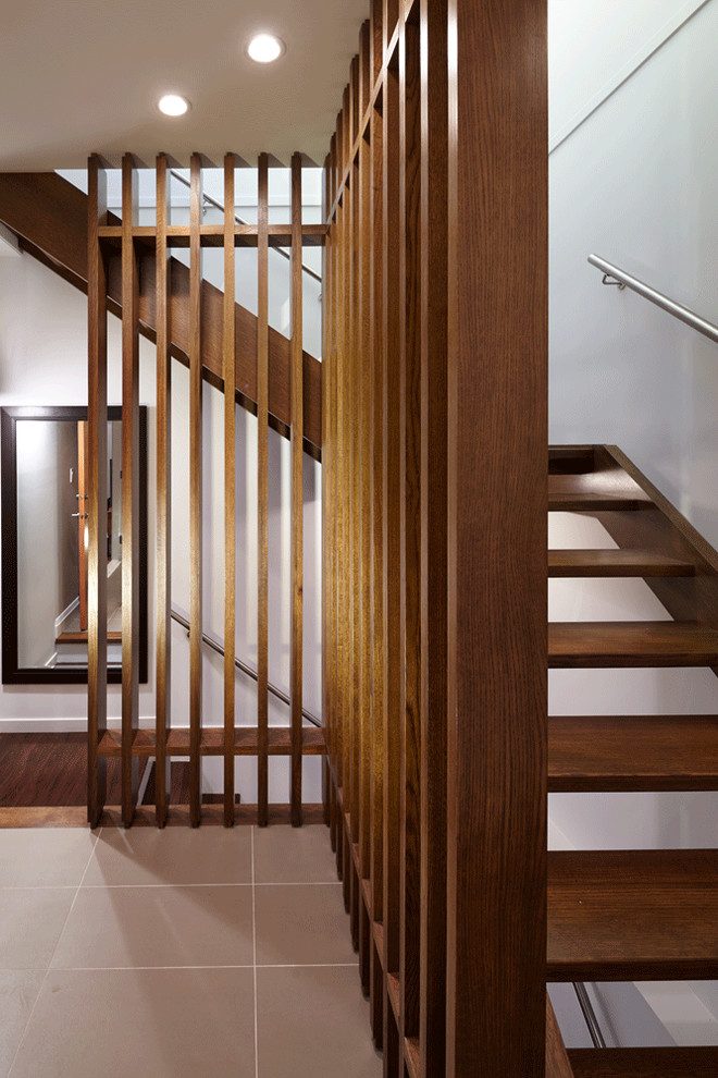 Inspiration for a large contemporary wooden l-shaped open staircase remodel in Vancouver