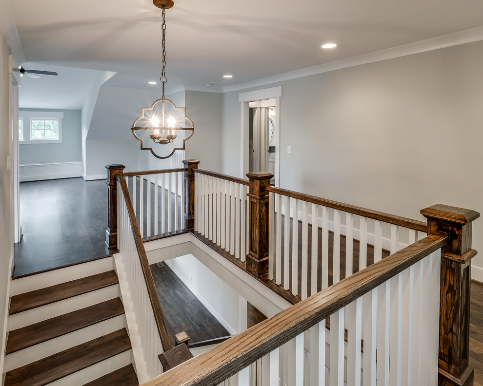 Medium sized traditional wood u-shaped staircase in Nashville with wood risers.