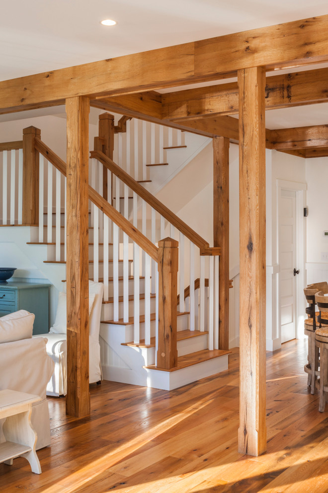 Country wood staircase in Portland Maine with painted wood risers.