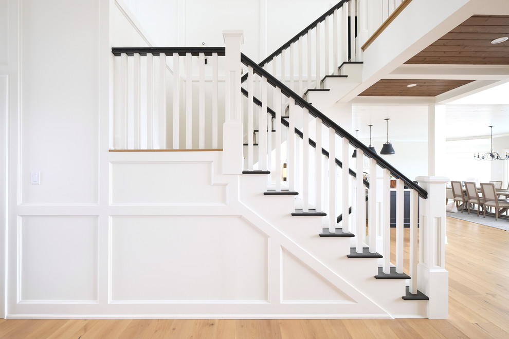 Example of a farmhouse painted u-shaped wood railing staircase design in Other with painted risers