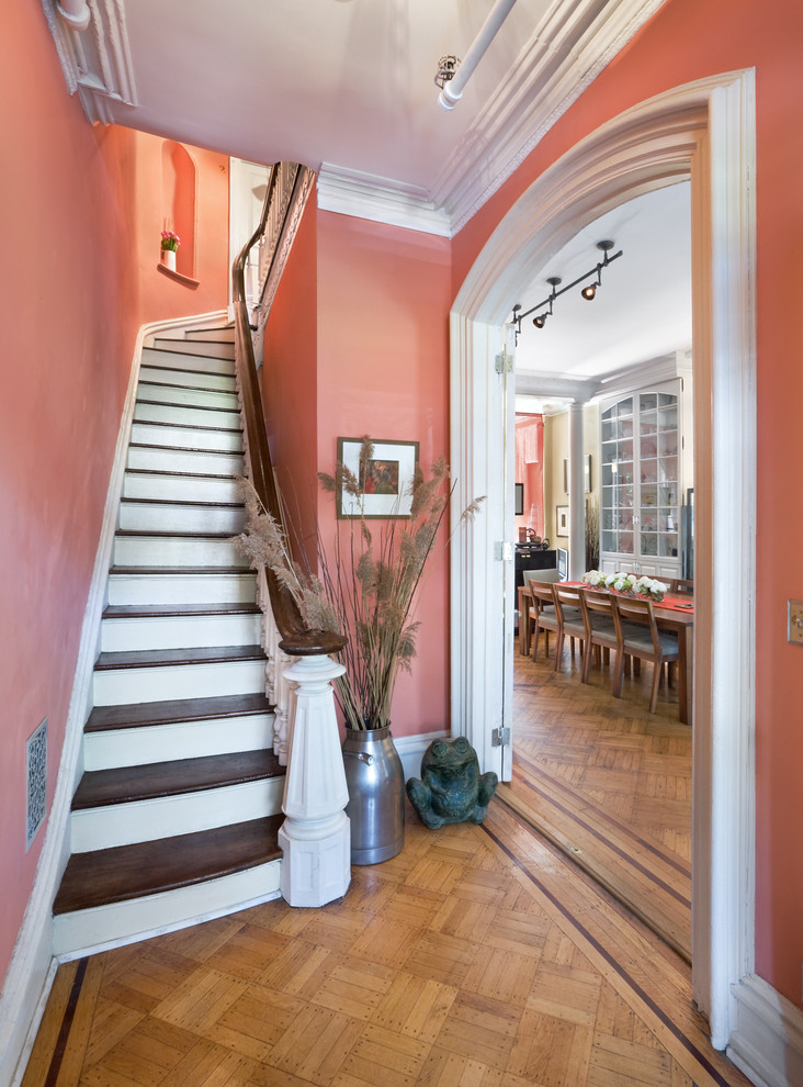 Inspiration for a small timeless wooden curved staircase remodel in New York