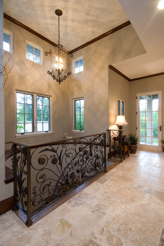 Huge tuscan l-shaped metal railing staircase photo in Denver