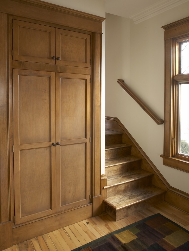 Design ideas for a traditional wood staircase in Minneapolis with wood risers.