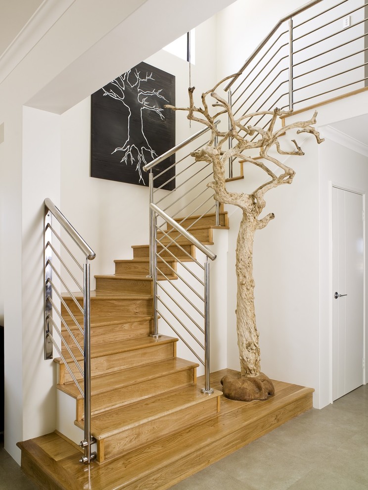 Trendy wooden u-shaped staircase photo in Perth with wooden risers