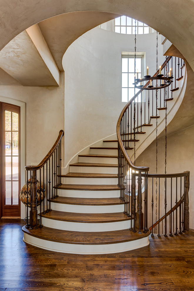Example of a large beach style wooden spiral staircase design in Other with wooden risers