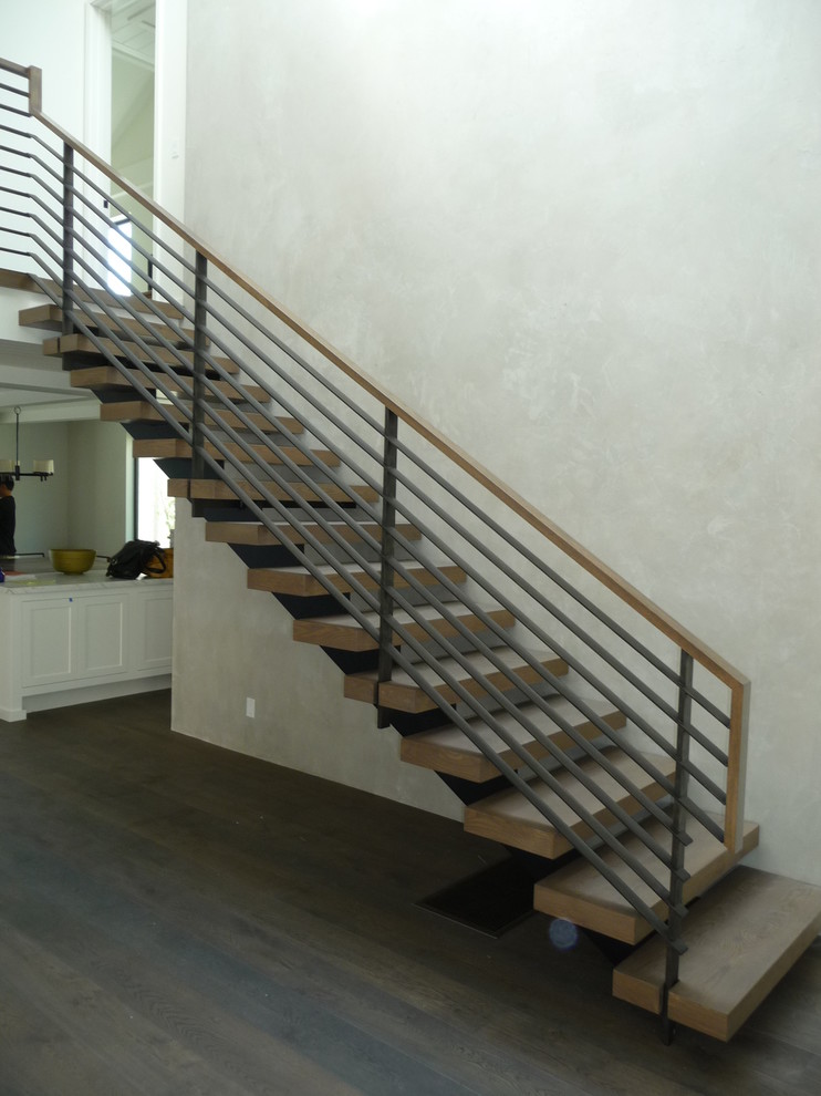 Inspiration pour un escalier sans contremarche flottant design avec des marches en bois.