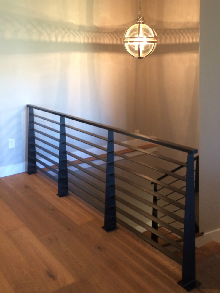 Design ideas for a medium sized contemporary wood straight staircase in Salt Lake City with wood risers.