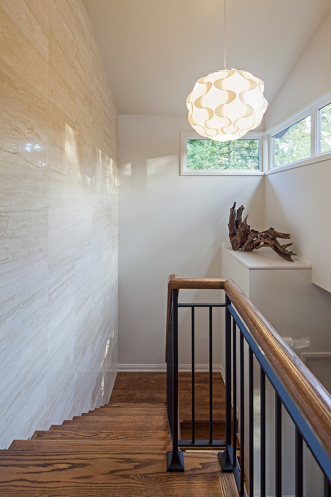 Example of a trendy wooden u-shaped staircase design in Toronto