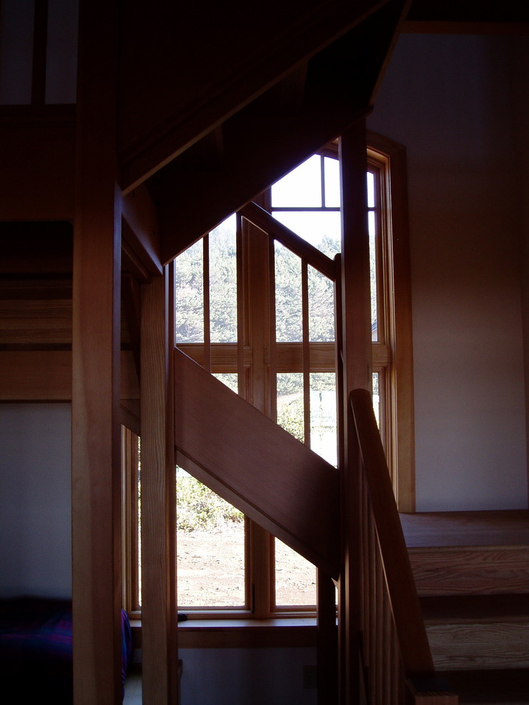Inspiration for a coastal wooden staircase remodel in Portland with wooden risers