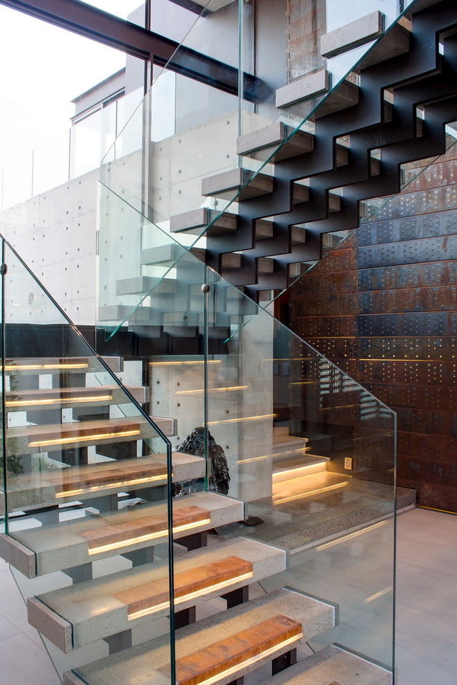 Пример оригинального дизайна: п-образная лестница в современном стиле с бетонными ступенями без подступенок