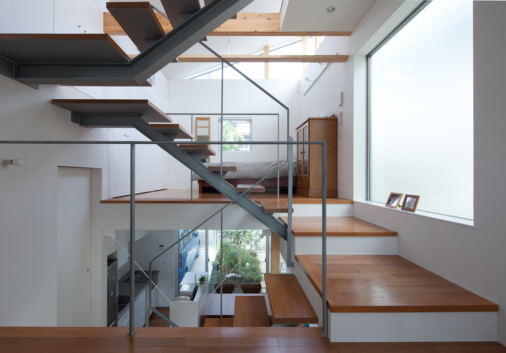 Inspiration for a contemporary l-shaped staircase remodel in Yokohama