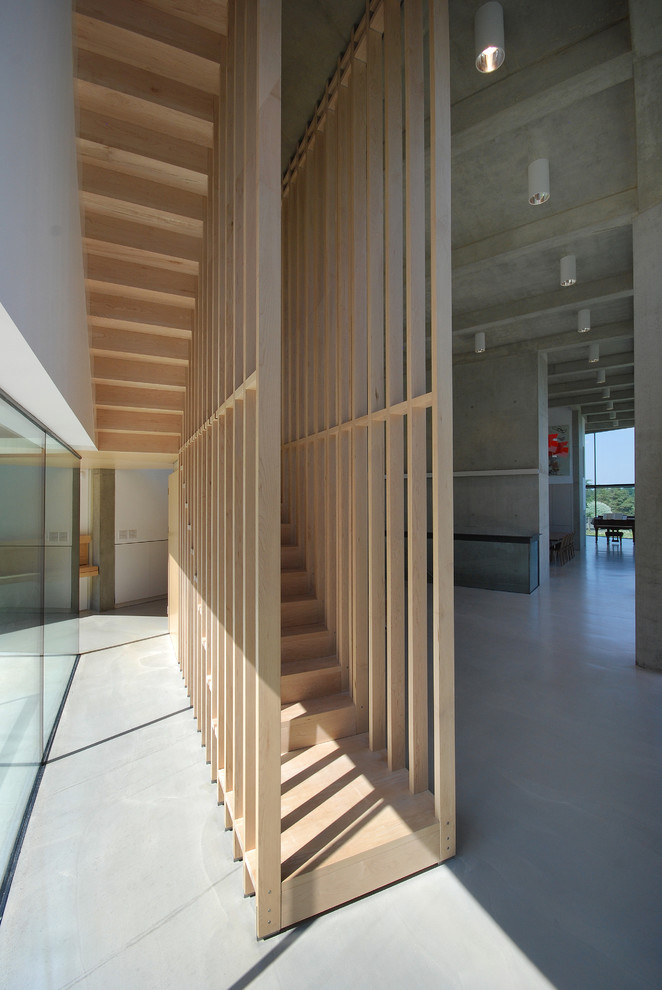 Источник вдохновения для домашнего уюта: п-образная деревянная лестница в стиле лофт с деревянными ступенями