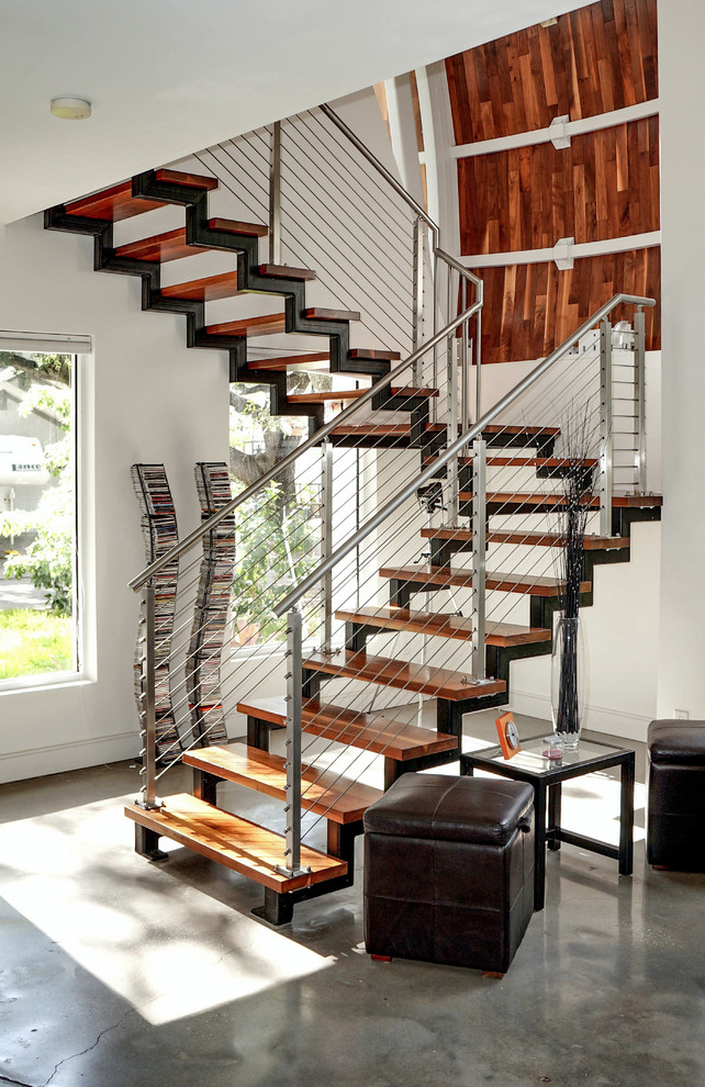 Inspiration for a mid-sized modern wooden floating open and metal railing staircase remodel in Tampa