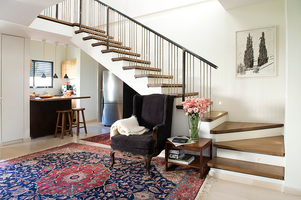 Exemple d'un escalier éclectique avec des marches en bois.