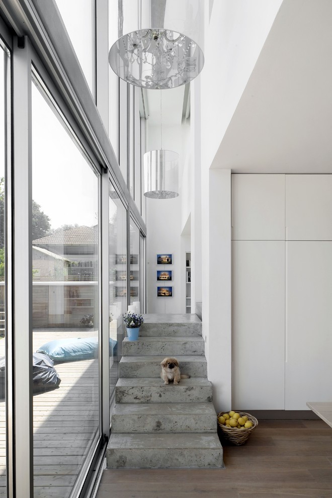 Modern concrete staircase in Tel Aviv with concrete risers.