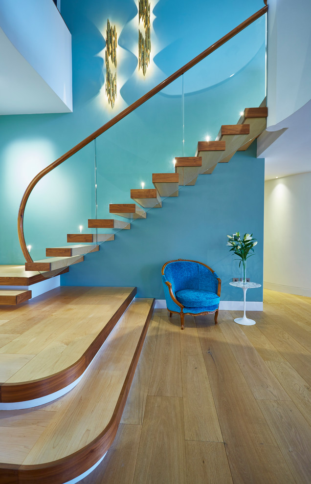 Modern wood l-shaped staircase in Devon with open risers.