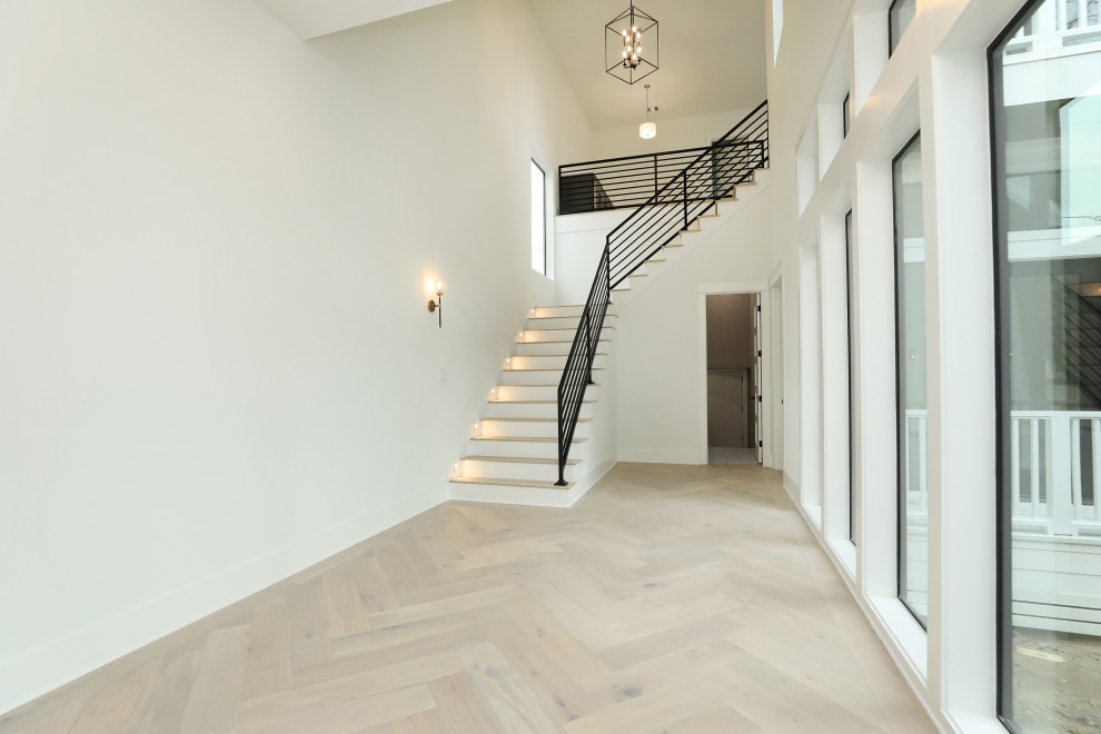 Example of a large farmhouse wooden l-shaped mixed material railing staircase design in Houston with painted risers