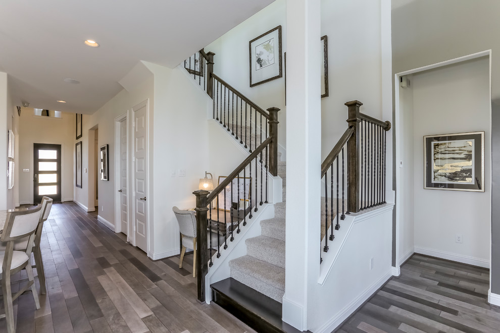 Staircase - mid-sized contemporary carpeted u-shaped metal railing staircase idea in Houston with carpeted risers