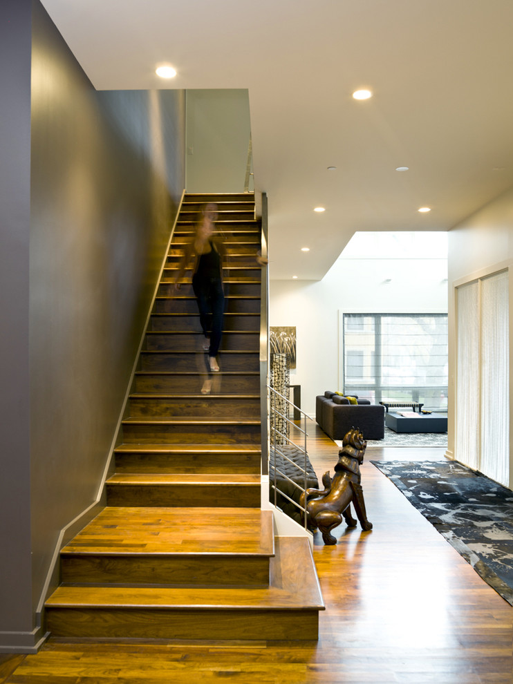 Inspiration for a contemporary wooden straight staircase remodel in Chicago with wooden risers