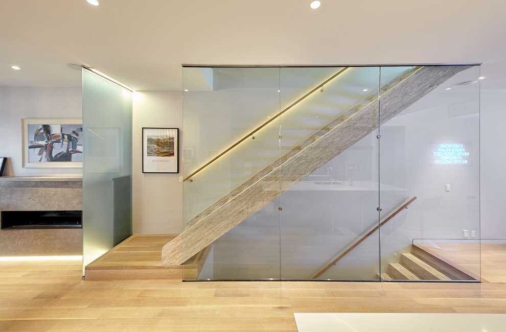 Photo of a contemporary wood straight wood railing staircase in Toronto with wood risers.