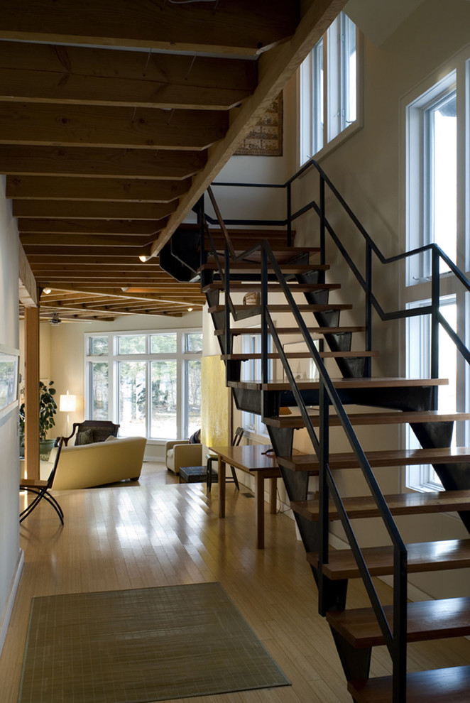 Inspiration for a medium sized industrial wood floating staircase in Boston with open risers and feature lighting.