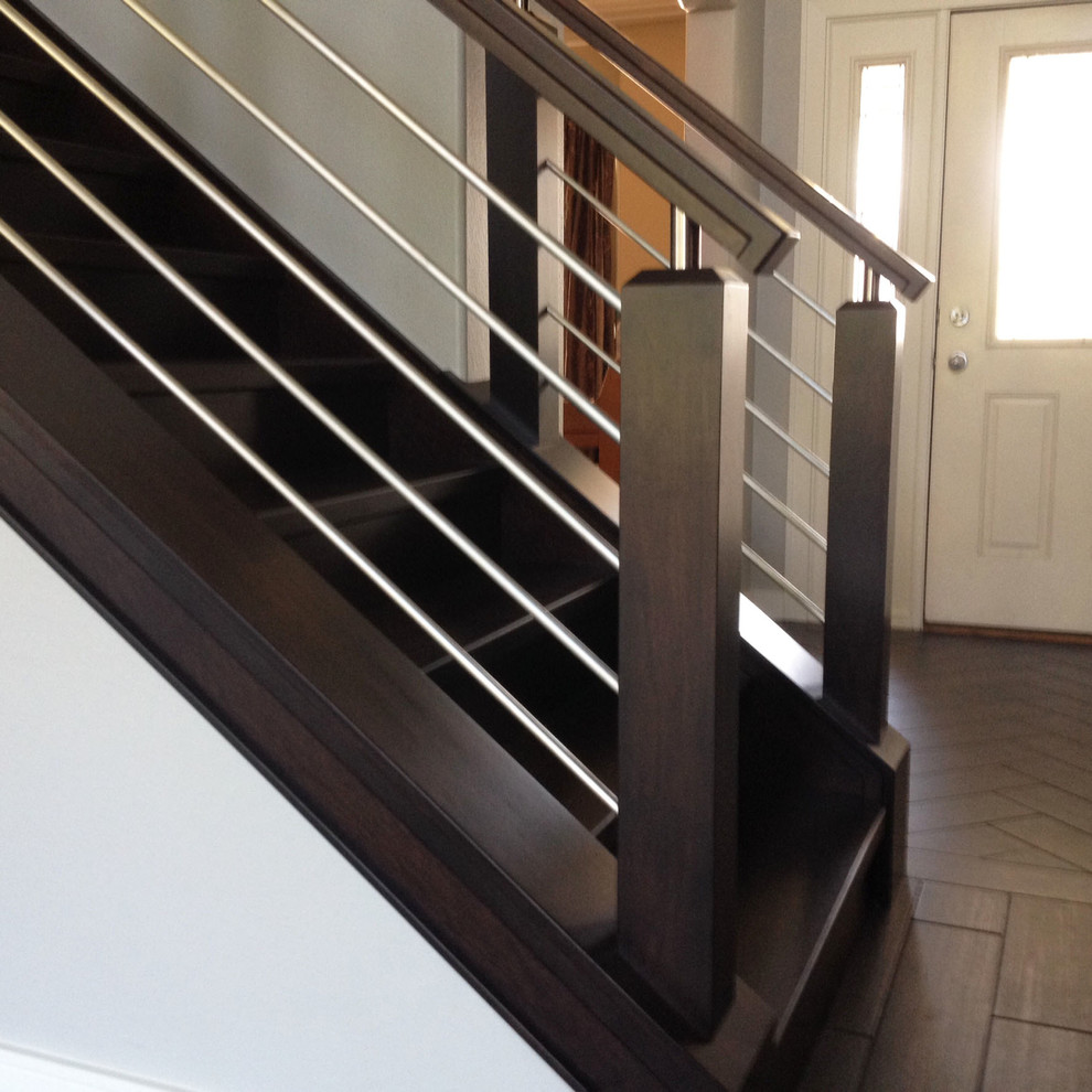 Photo of a medium sized modern wood straight wood railing staircase in Other with wood risers.