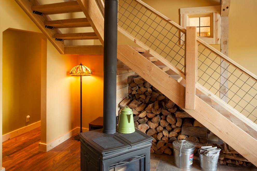 Photo of a traditional wood l-shaped staircase in Other with open risers.