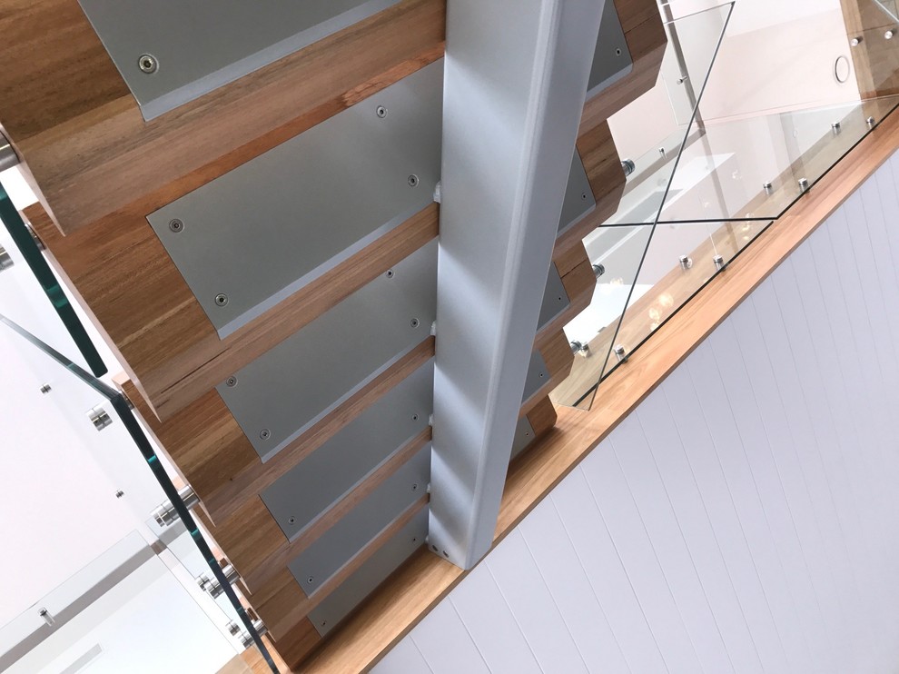 This is an example of an urban wood u-shaped mixed railing staircase in Newcastle - Maitland.