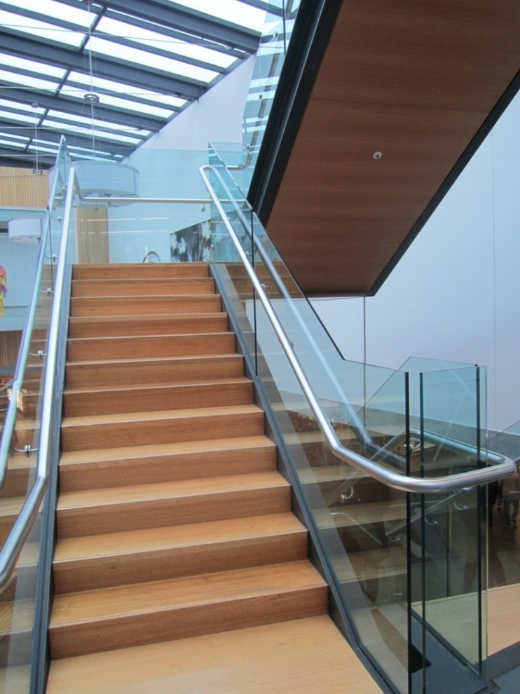 Staircase - modern wooden staircase idea in Hamilton