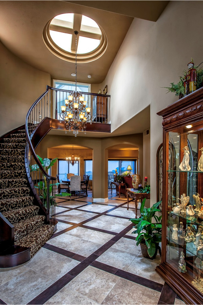 Inspiration for a large mediterranean wooden curved wood railing staircase remodel in Orange County with wooden risers
