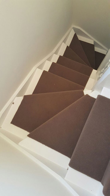 Design ideas for a medium sized traditional carpeted u-shaped wood railing staircase in London with carpeted risers.