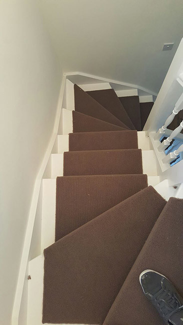 Inspiration for a medium sized traditional carpeted u-shaped wood railing staircase in London with carpeted risers.