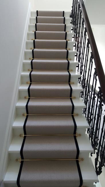 Design ideas for a medium sized eclectic carpeted u-shaped staircase in London with carpeted risers.