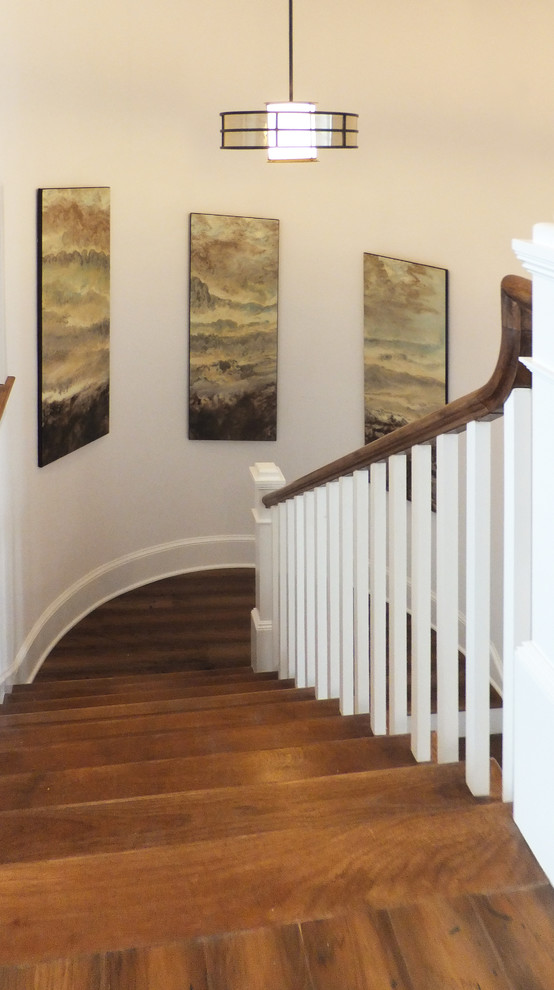 Example of a large classic wooden spiral staircase design in Tampa with wooden risers