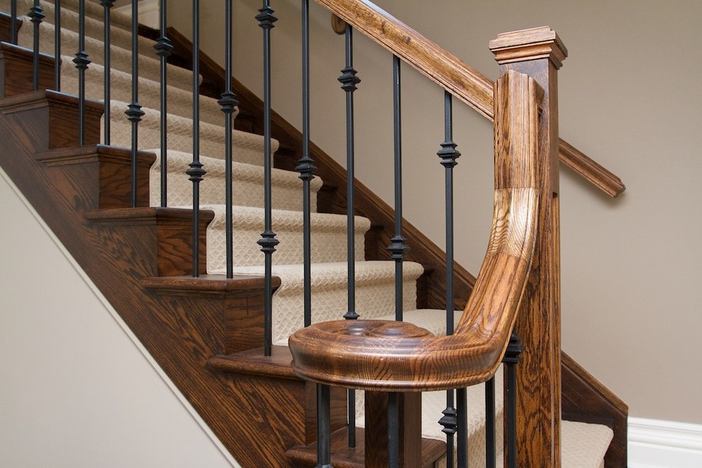 This is an example of a contemporary carpeted staircase in Toronto with carpeted risers.