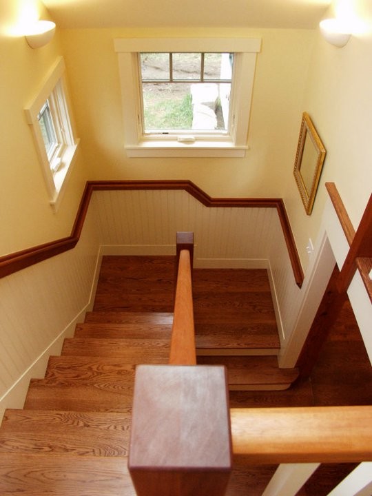Exemple d'un grand escalier craftsman avec des marches en bois.