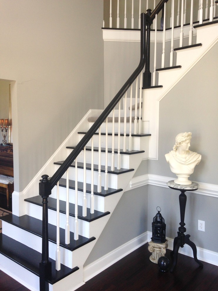 Inspiration for a contemporary staircase remodel in Charlotte with wooden risers