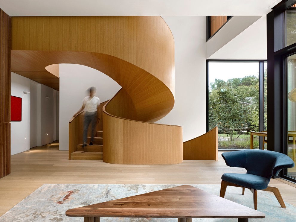Inspiration for a contemporary wooden spiral wood railing staircase remodel in Toronto with wooden risers