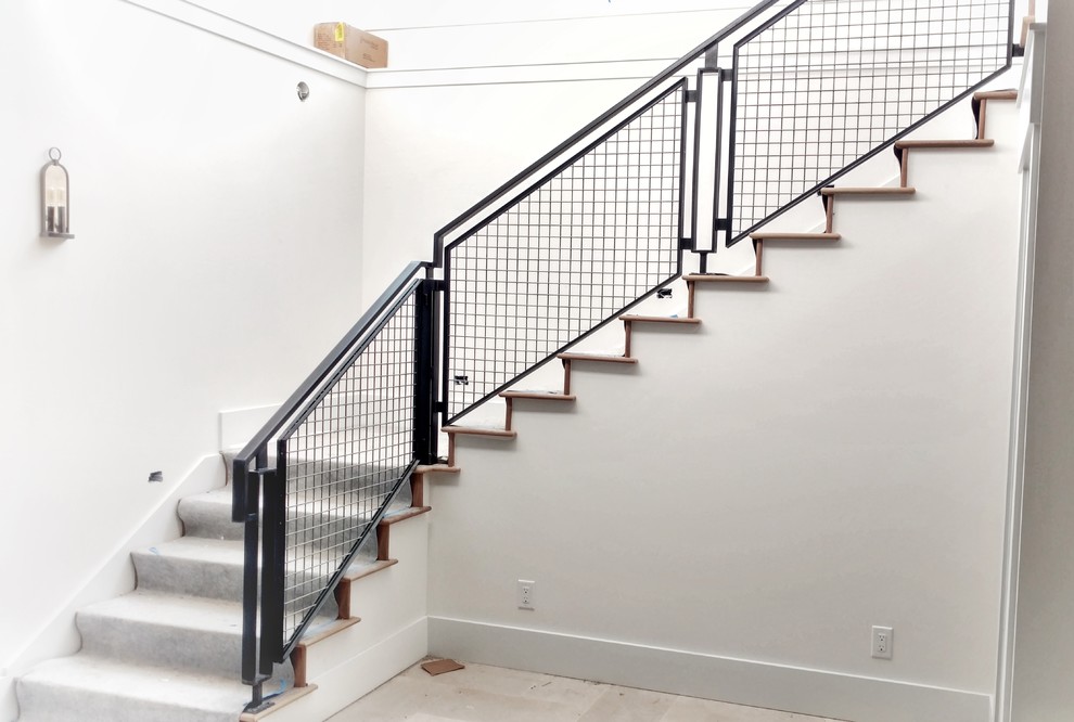 Пример оригинального дизайна: угловая бетонная лестница среднего размера в стиле модернизм с металлическими перилами и бетонными ступенями