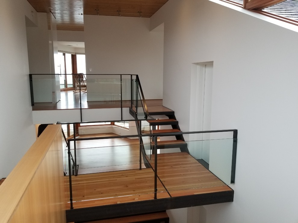 Modern glass railing staircase in Seattle.