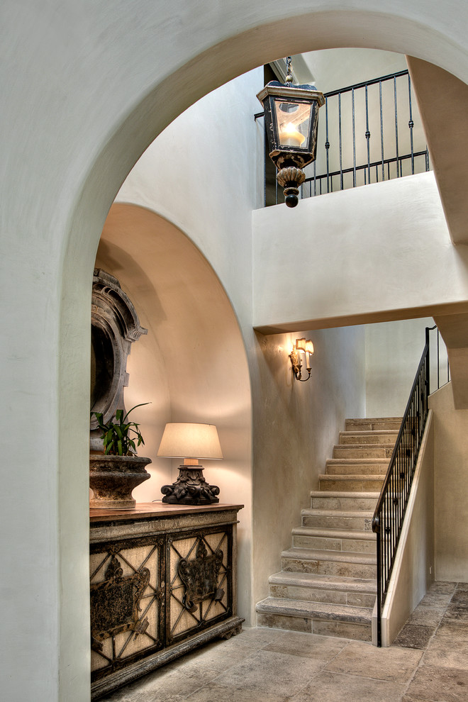 Design ideas for a mediterranean staircase in Houston with feature lighting.