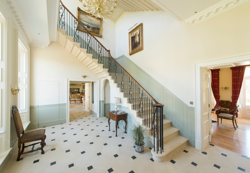 Inspiration for a timeless carpeted l-shaped staircase remodel in Gloucestershire with carpeted risers