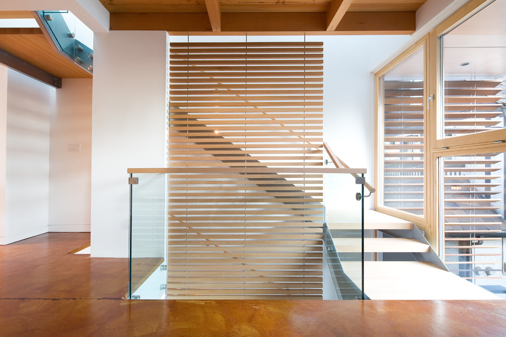 Photo of a contemporary staircase in Vancouver with open risers.