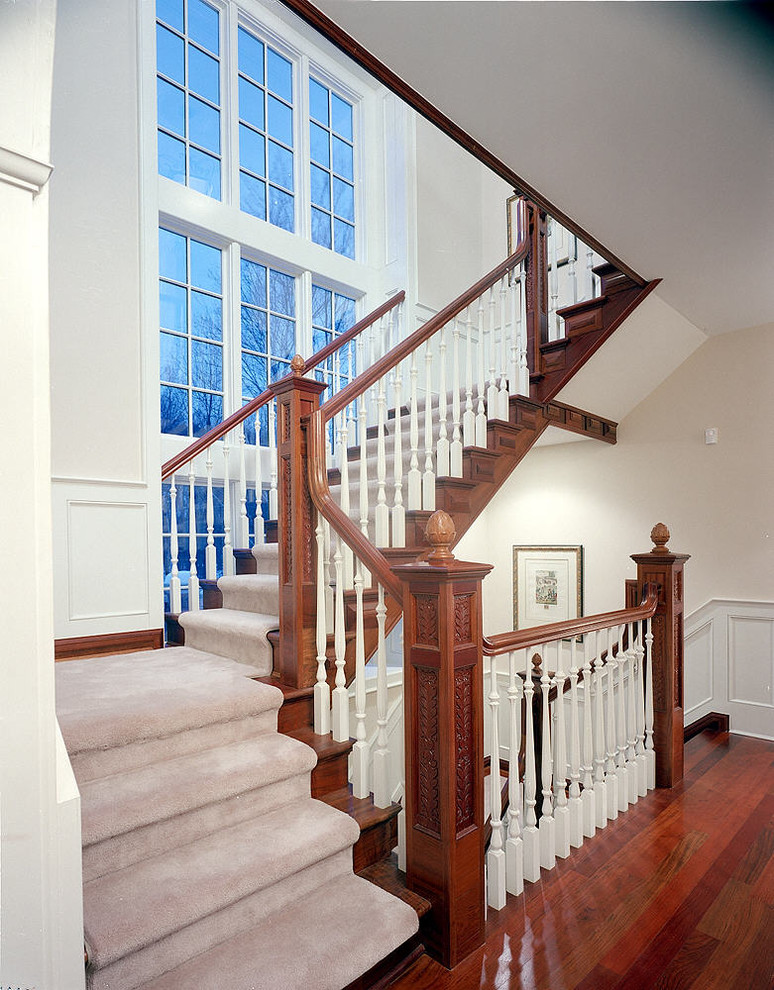 Example of a large classic carpeted u-shaped staircase design in Detroit with carpeted risers
