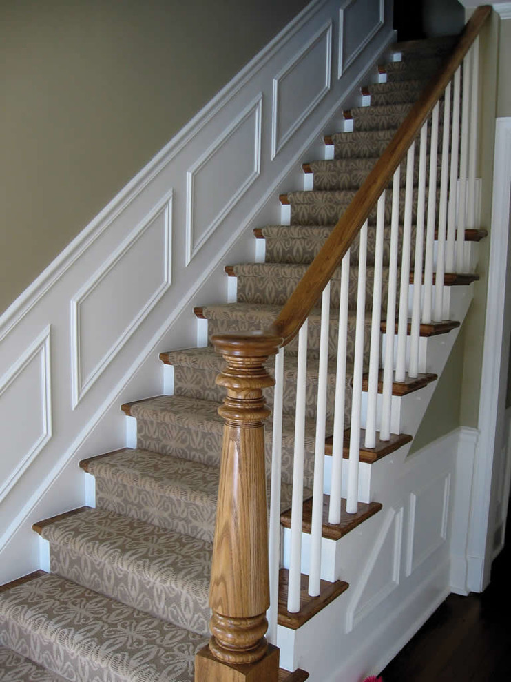 Inspiration for a large timeless carpeted straight wood railing staircase remodel in Chicago with carpeted risers