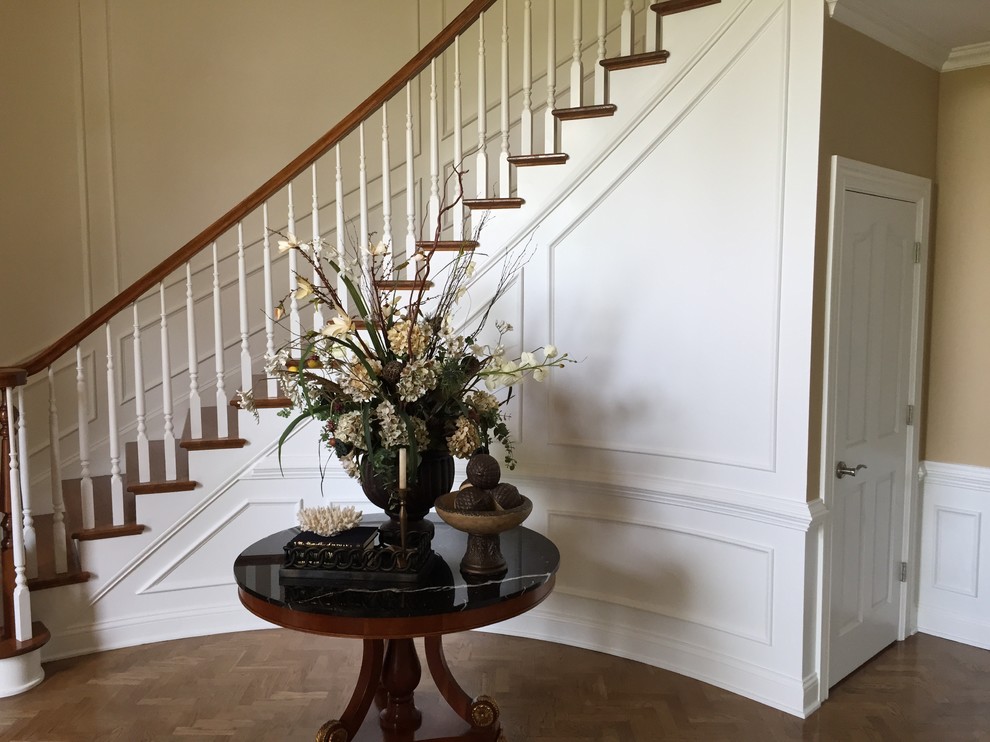 Design ideas for a medium sized traditional wood curved staircase in Louisville with painted wood risers.