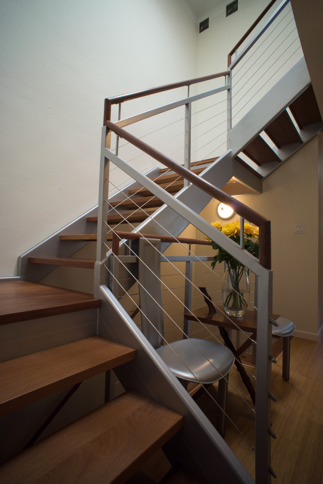 Inspiration for a medium sized modern wood u-shaped staircase in Denver with open risers.
